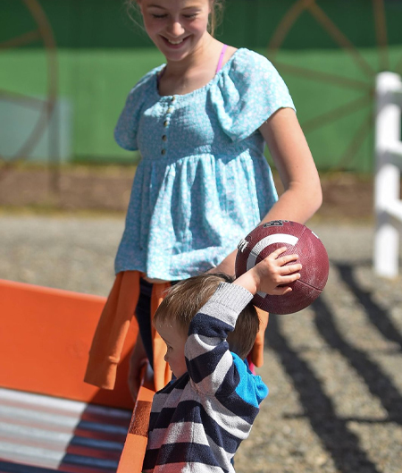 Young Boy Ready To Throw Football