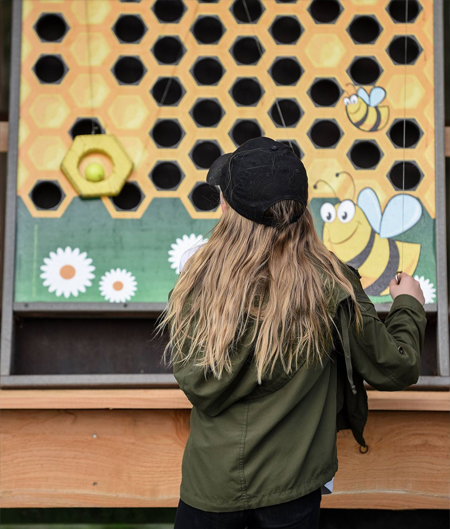 Child Playing At The Wall Maze