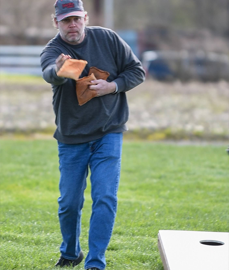 Man Tosses Cornhole Bags